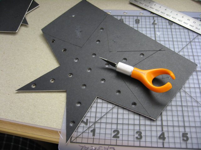 Cutting out the outline of the Christmas Star.