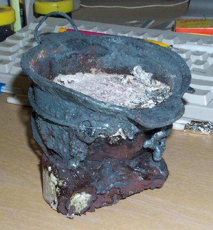 melted crucible fused to vitrified plinth