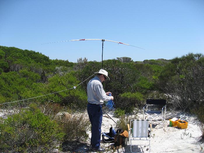 Peter VK2TPM untangling counterpoise wire with Ozi-pole in the background